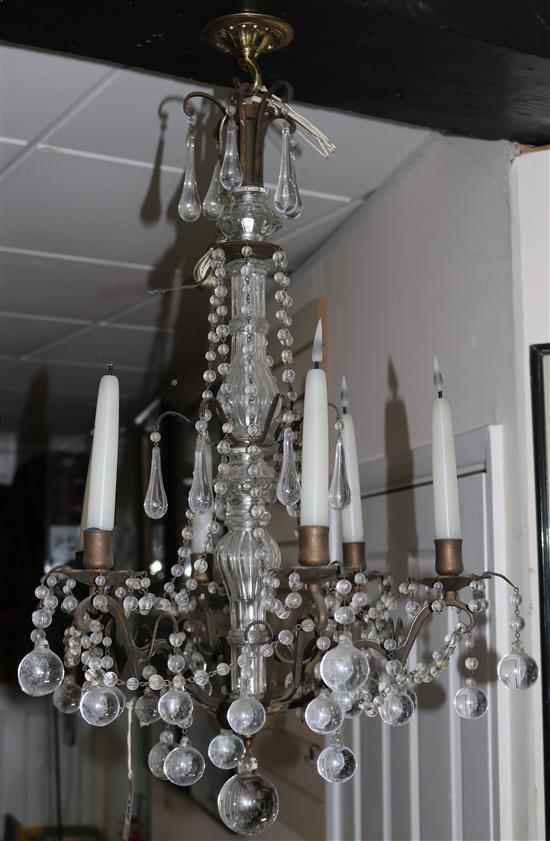 A 17th century style bronzed metal and glass chandelier, with ball drops, wired for electricity
